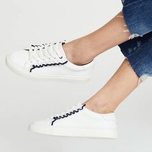 Tory Burch Ruffle sneakers. Size 10M. White with elegant‎ black ruffle.